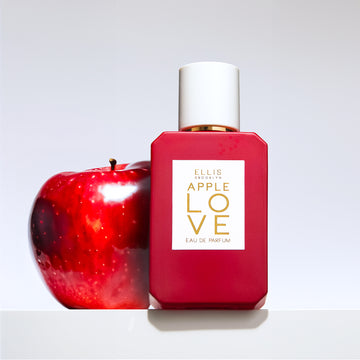 Apple Love 50ml red bottle with red apple on grey background.