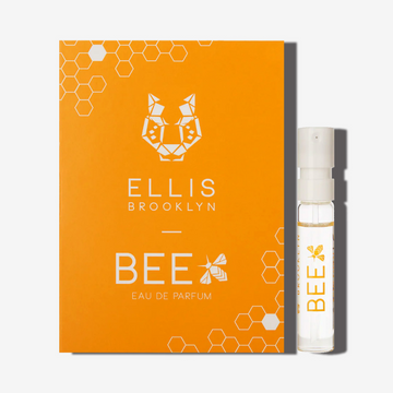 Bee 1.5ml Eau De Parfum Vial next to orange Bee Eau De Parfum vial holder card.