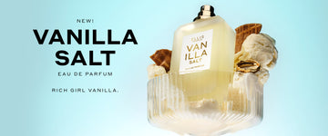 Vanilla Salt 50ml Eau De Parfum without cap on glass with vanilla ice cream, pieces of ice cream cone, and gold ring, on light blue background with black text that reads  "New! Vanilla Salt Eau De Parfum Rich Girl Vanilla."
