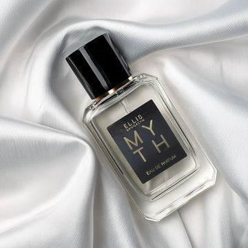 Myth 50ml Eau De Parfum on white satin sheet.