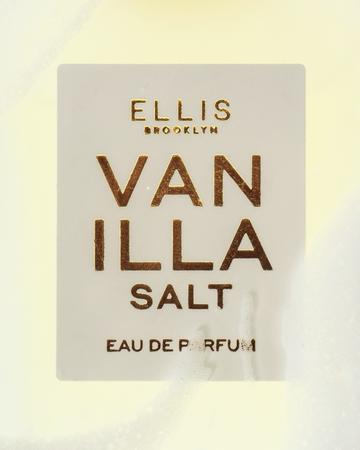 Closeup of VANILLA SALT Eau de Parfum 50ml with white foam.