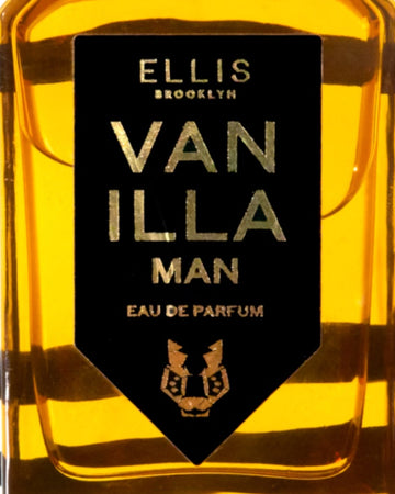 Vanilla Man 50ml Eau De Parfum label on bottle in front of vanilla beans.