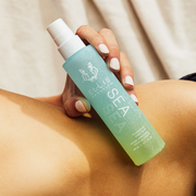 IMAGE 5: MODEL HOLDING SEA FRAGRANCE AND BODY MIST 50ML