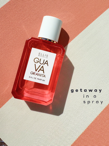 GUAVA GRANITA Eau de Parfum 50ml lays on pink and white striped fabric with black text that reads 'getaway in a spray'