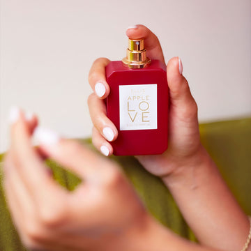 IMAGE 5: MODEL SPRAYING APPLE LOVE