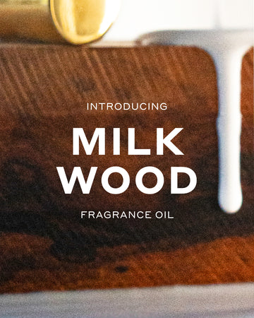 Milk Wood 15ml Fragrance Oil resting on piece on wood with milk dripping off it and white text that reads 