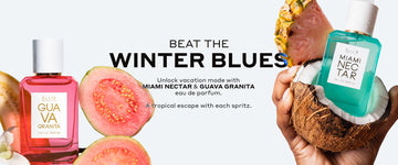Guava Granita Eau de Parfum 50ml surrounded by 2 slices of cut guava, half of a cut banana and a flower, black text that reads "Beat The Winter Blues. Unlock vacation mode with MIAMI NECTAR & GUAVA GRANITA eau de parfum. A tropical escape with each spritz.", and a hand holding half of a cut coconut with Miami Nectar Eau de Parfum 50ml inside of it and a slice of pineapple with pink flesh all on a light gray background. 
