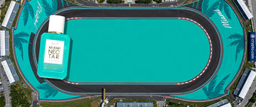 Aerial view of formula one race track in teal and black with white text that reads 'Miami' and a dark teal palm tree design overlaid with a MIAMI NECTAR Eau de Parfum 50ml bottle surrounded by grass and gray buildings