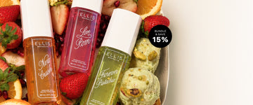 NEW CRUSH Perfume Mist 90ml, LOVE POM Perfume Mist 90ml, FOREVER PISTACHIO Perfume Mist 90ml lay in white bowl with pistachio ice cream, pistachios, strawberries, orange slices, and pomegranate seeds and a black circle with white text that reads "Bundle & Save 15%' on a white background 