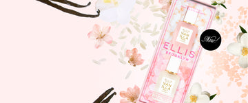 Twice as Nice gift set containing one 7.5mL mini Vanilla Salt & 1 7.5mL mini Vanilla Rice eau de parfum bottles in a pink floral window box packaging, styled with white and pink flowers, rice, pink salt and vanilla beans on a white background with a black circle and white text that reads "New!"