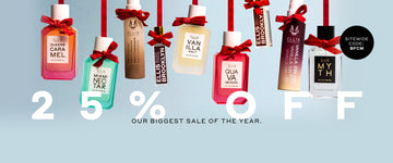 Queens Caramel 50ml, Miami Nectar 50ml, Marshmallows 50ml, Milk Wood Fragrance Oil Rollerball, Vanilla Salt 50ml, Guava Granita 50ml, Vanilla Santo Fragrance Oil Rollerball, Vanilla Sin 50ml, and Myth 50ml each tied near nozzle with red bow and hanging, on blue background with black circle with blue text that reads "Sitewide code: BFCM" white text that reads "25% Off" and black text that reads "Our Biggest Sale Of The Year."