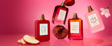 PLUM TONIC, QUEENS CARAMEL, APPLE LOVE and VANILLA RICE eau de parfum 50mL bottles with plum, vanilla bean, apple slices and floral accents on a hot pink background.