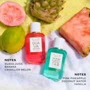 Half guava, whole guava, whole pineapple, and slice of pink pineapple on yellow and white striped beach towel above Guava Granita 7.5ml Eau De Parfum Mini Dabber, black next that reads "Notes Guava Juice Bannana Cavaillon Melon" and Miami Nectar 7.5ml Eau De Parfum Mini Dabber and black text that reads "Notes Pink Pineapple Coconut Water Vanilla"
