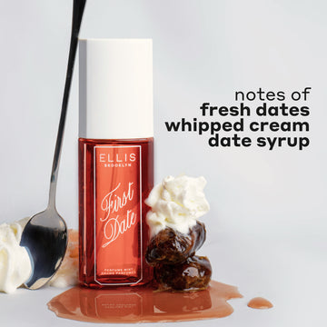 FIRST DATE Perfume Mist 90ml next to whipped cream, a spoon leaning against the bottle, a stack of 2 dates and whipped cream on date syrup with black text that reads "notes of fresh dates, whipped cream, date syrup" on a white background