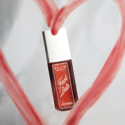 FIRST DATE Perfume Mist 90ml on gray background surrounded by a red heart drawn in lipstick