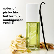 FOREVER PISTACHIO Perfume Mist 90ml between white icing, pistachios, and a vanilla bean against a white background with black text that reads "notes of pistachio, buttermilk, madagascar vanilla"