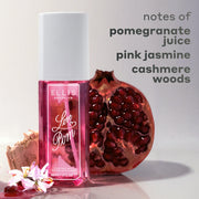 LOVE POM Perfume Mist 90ml between white flower, pomegranate juice, wood, and half of a pomegranate against white background with gray text that reads "notes of pomegranate juice, pink jasmine, cashmere woods"