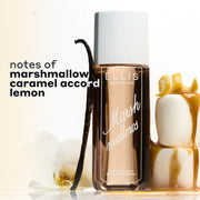 MARSHMALLOWS Perfume Mist 240ml between 2 stacked marshmallows covered in dripping caramel and topped with a lemon peel and a vanilla bean and flower leaning against the bottle on a white background with black text that reads "notes of marshmallow, caramel accord, lemon"