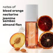 NEW CRUSH Perfume Mist 90ml between sliced blood oranges, sliced nectarine, white flower petal and almonds against white background with black text that reads "notes of blood orange, nectarine, jasmine sambac, almond flan"