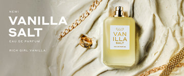 Vanilla Salt 50ml Eau De Parfum without cap in melted vanilla ice cream next to gold ring, gold bracelets, and pieces of ice cream cone next to white text that reads 