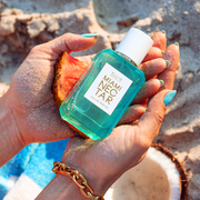 IMAGE 4: Hands holding MIAMI NECTAR with Pink Pineapple