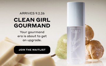 COCOA BLANCO Perfume Mist 90ml in front of pear and cream puffs and behind squares of white chocolate on a gray background with black text that reads "Arrives 9.2.26. Clean Girl Gourmand. Your gourmand era is about to get an upgrade." and a black oval with white text that reads "Join The Waitlist"