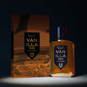 Vanillla Man 50ml Eau De Parfum next to Vanilla Man Eau De Parufm box in spotlight, on black background.