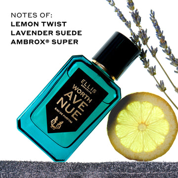 Worth Avenue 50ml Eau De Parfum on piece of denim leaning on lemon slice next to lavender plant on white background with black text that reads "Notes of: Lemon Twist Lavendar Suede, Ambrox Super"