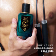 Model with jump rope around shoudlers holding Woth Avenue 50ml Eau De Parfum covered in water droplettes in one hand to chest above white text that reads "Smells like a killer-good cologne."