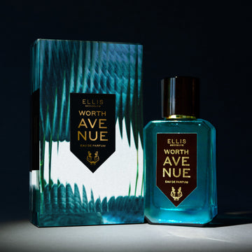 Worth Avenue 50ml Eau De Parfum next to Worth Avenue Eau De Parufm box in spotlight, on black background.