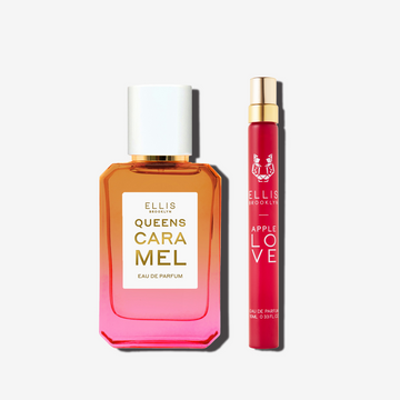 50mL bottle of Queens caramel eau de parfum next to a 10mL travel size of Apple Love eau de parfum set in front of a white background.