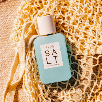 SALT Eau de Parfum 50ml lays on a tan knit bag
