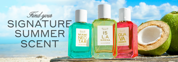 MIAMI NECTAR Eau de Parfum 50ml, ISLA SIRENA Eau de Parfum 50ml, and GUAVA GRANITA Eau de Parfum 50ml all covered in water droplets stand next to half of a coconut and a whole, green coconut on top of gray wood against a background of blue ocean and blue sky with white clouds  with gray text that reads "Find your signature summer scent"