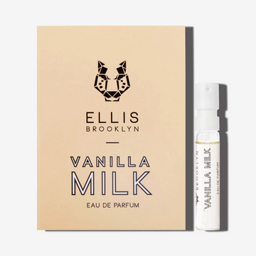 Vial de Vanille Lait 1,5 ml Eau de Parfum à côté de la carte support de flacon beige Vanille Lait Eau de Parfum.