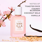 VANILLA RICE Eau de Parfum 50ml next to toasted rice, vanilla beans, and pink sakura blossoms on a pink background with gray text that reads "Notes of toasted rice, cherry blossom, coconut milk, vanilla"