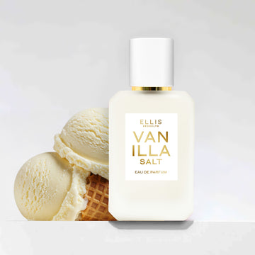 Vanilla Salt 50ml bottle and scoops of vanilla ice cream and cone on a grey background. 