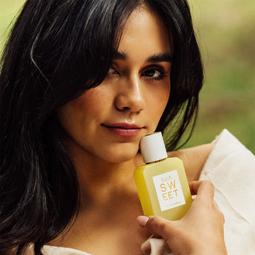 IMAGE 3: Model holding SWEET 50ML BOTTLE