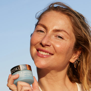 IMAGE 6: MODEL HOLDING Satisfying Skin Caring Moisturizer