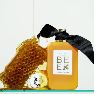 IMAGE 5: Honey dripping on BEE 100ML BOTTLE AND HONEYCOMB