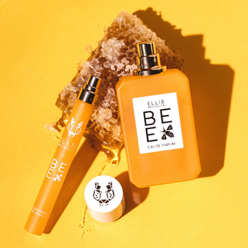 IMAGE 2: BEE 50ML BOTTLE AND TRAVEL SPRAY on honeycomb