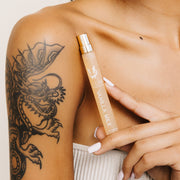 IMAGE 5: MODEL HOLDING VANILLA MILK TRAVEL SPRAY NEAR SHOULDER