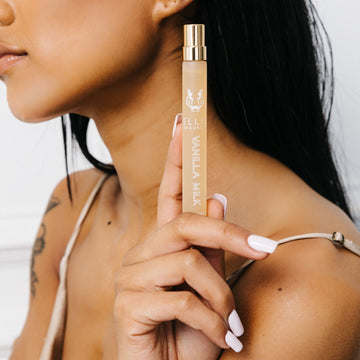 IMAGE 3: Model holding VANILLA MILK travel spray