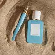 IMAGE 5: SALT TRAVEL SPRAY AND 50ML BOTTLE IN SAND