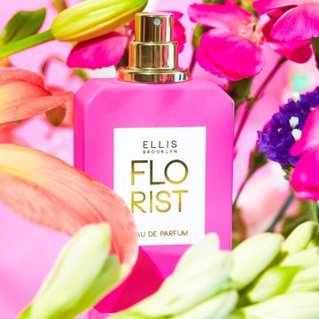 IMAGE 3: FLORIST 50ML BOTTLE WITH FLOWERS AND PINK BACKDROP