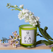 IMAGE 3: FABLE candle near flowers