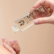 IMAGE 3: MODEL HOLDING MYTH body oil