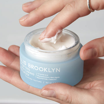 IMAGE 4: Hands holding Satisfying Skin Caring Moisturizer