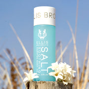 IMAGE 6: SALT body oil at beach WITH FLOWERS 