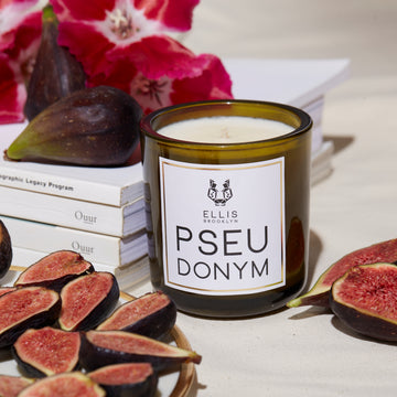 IMAGE 4: PSEUDONYM candle WITH BOOKS AND SCENT NOTES 
