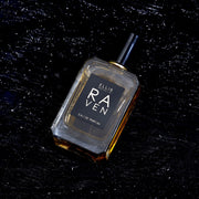 Raven 50ml Eau De Parfum on black glittery fabric.